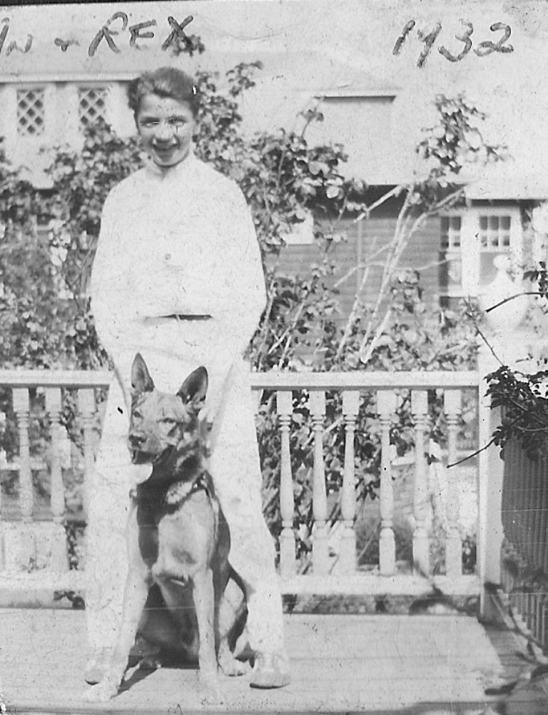 John stands with his German shepherd Rex on the front porch of his home on Oakton Avenue in 1932. In a family of well regarded brothers and sisters, John was deemed the kindest of all.