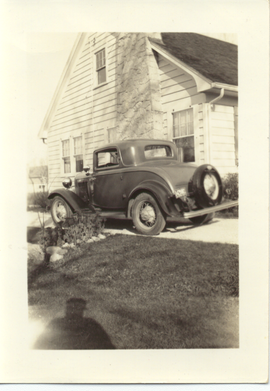 He drove two cars as a teen, one a ’36 Ford convertible and ’32 Ford V8 coupe. Here is the coupe, parked outside his boyhood home in Glen Ellyn. About the coupe, he said, “I had it about a year, and then Dad got me a ’36 Ford convertible coupe. That was it. I was a terror.” (credit: Brown Family)