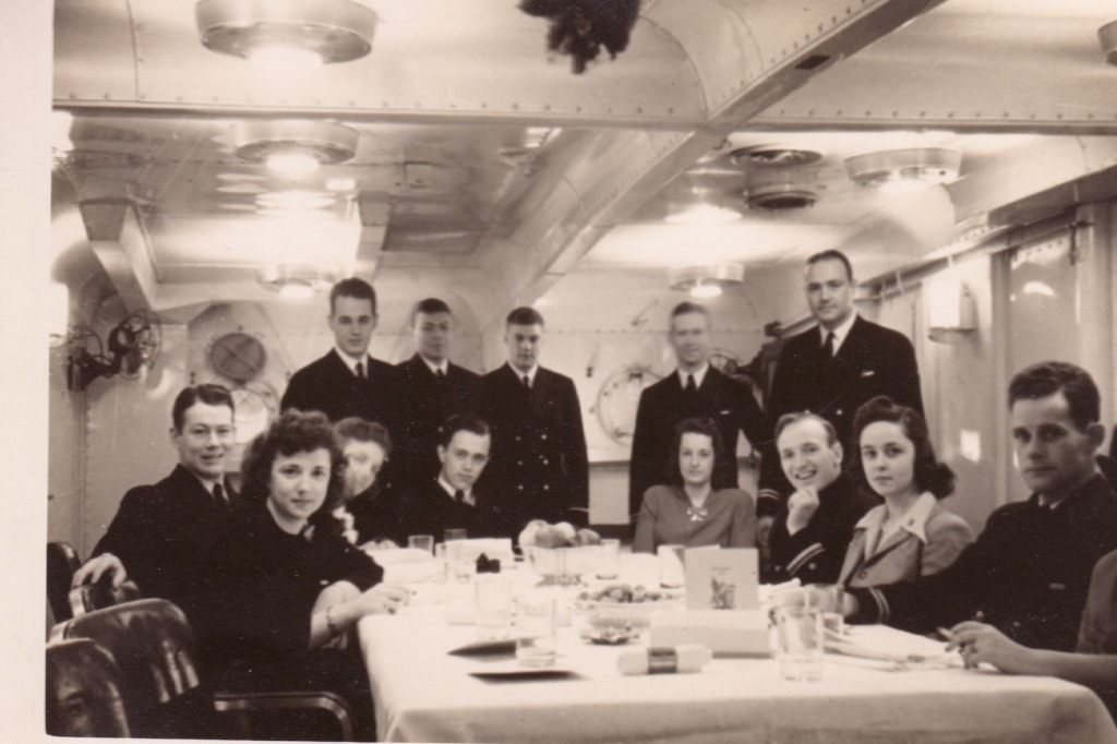 Christmas dinner in Plunkett’s wardroom in 1942, with the ship’s officers and wives. Ken Brown is seated at the head of the table. Jack Simpson is seated with hand on chin, his wife Peggy to his left. Jack Collingwood is seated at far left. Note the menu on the tabletop. (credit: Jack Simpson Family)