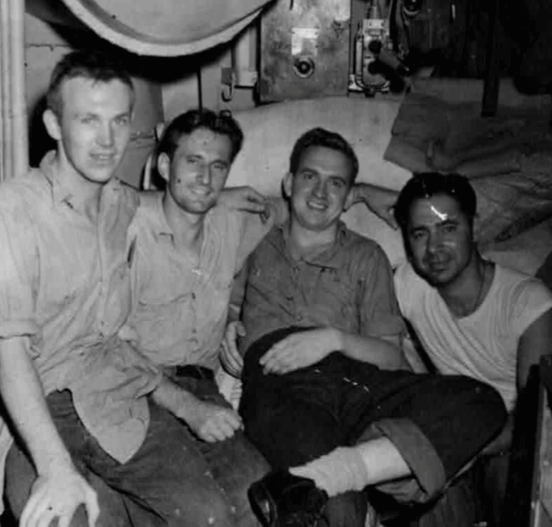 Four of Plunkett’s crew lounge in the electric shop in August of 1944. Charles T. (C.T.) Renie is second from right. The picture’s caption notes the men as Willie, John, C.T. and Al. John may John E. Landers, who was an Electrician’s Mate Second Class in Dec. 1943.