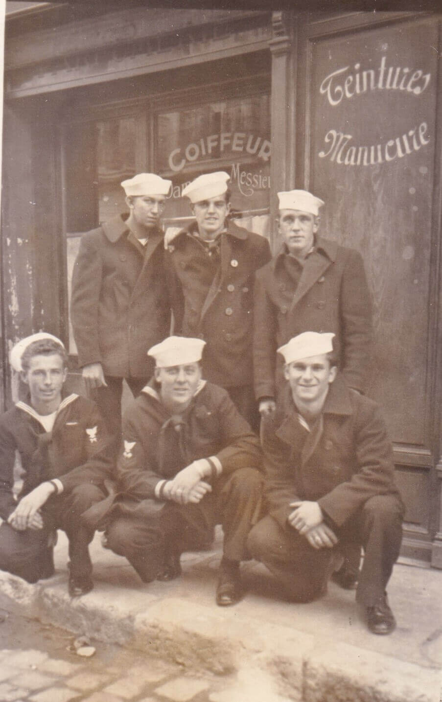 Crew from the Plunkett in Toulon, France, November 1944. The only identified crew member is John Marshall at top center. (credit: Jeanne Marshall)